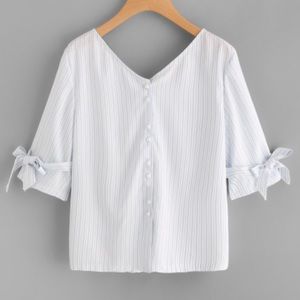 NWOT Thin blouse with ties on sleeves and on back.